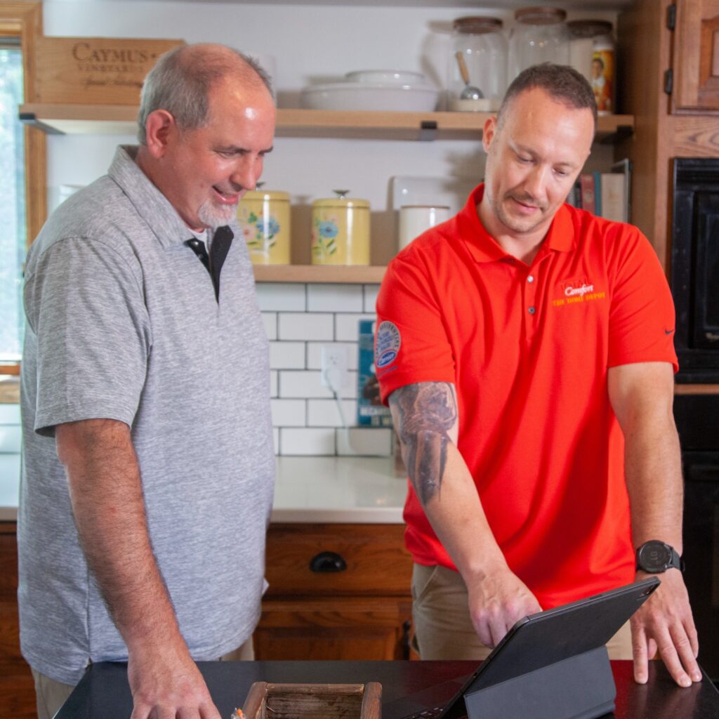 Homeowner talking to HVAC Technician