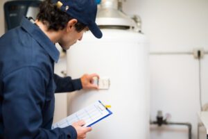 HVAC technician inspecting heater