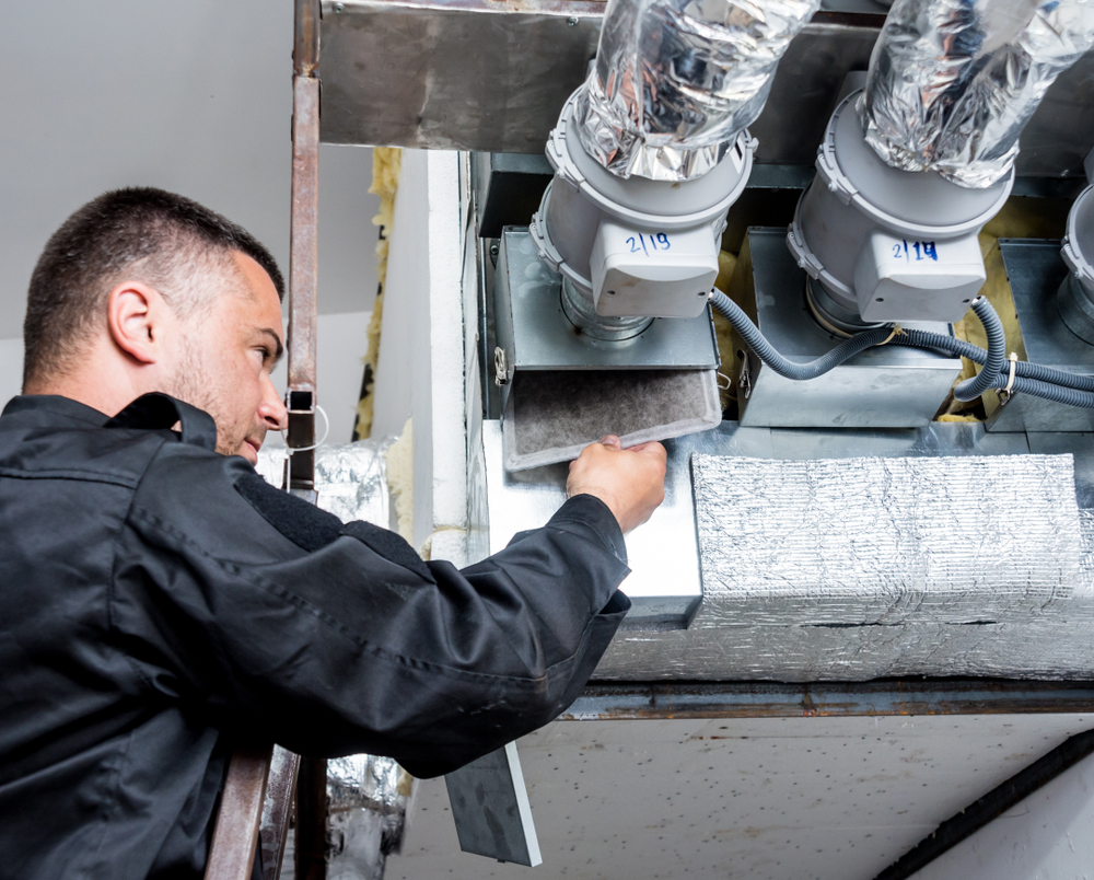Air duct cleaning technician