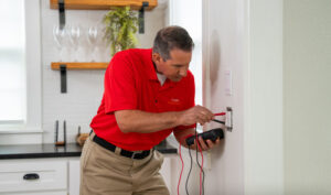 Electrician installing an outlet