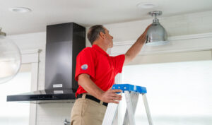 electrician installing indoor lighting